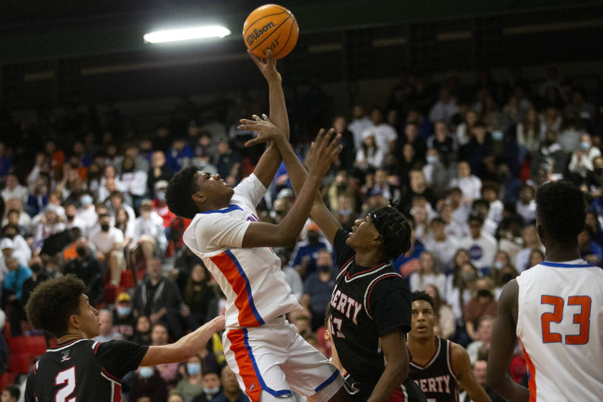 Bishop Gorman’s Jason Richardson (4) shoots against Liberty’s D'angelo Dailey (23 ...