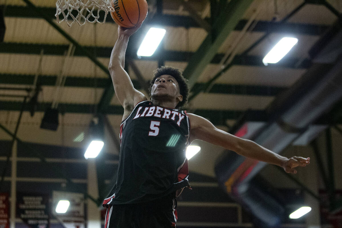 Liberty’s Joshua Jefferson (5) dunks against Bishop Gorman during the second half of a b ...