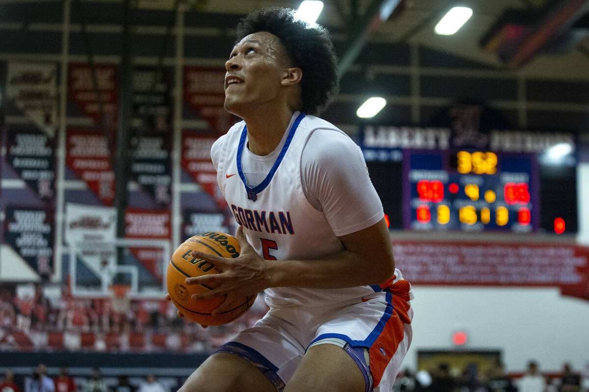 Bishop Gorman’s Darrion Williams (5) dips before shooting a layup against Liberty during ...