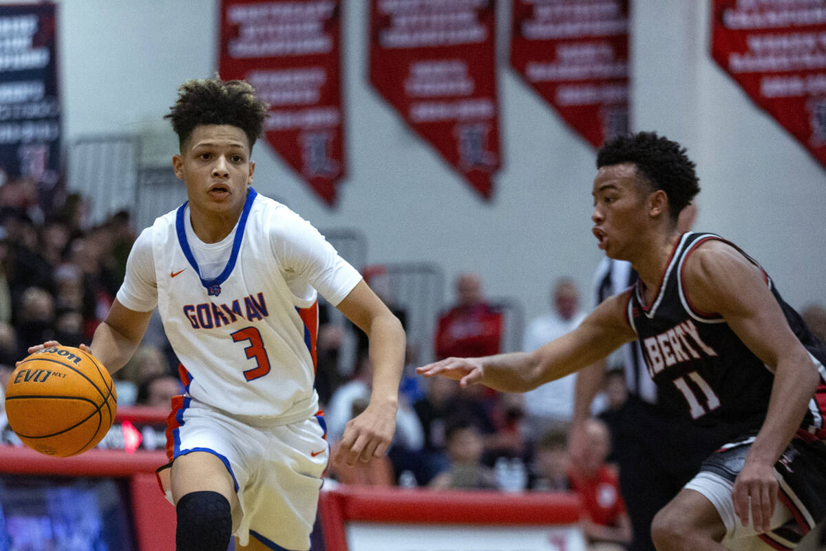 Bishop Gorman’s John Mobley Jr. (3) dribbles past Liberty’s Dedan Thomas (11) dur ...