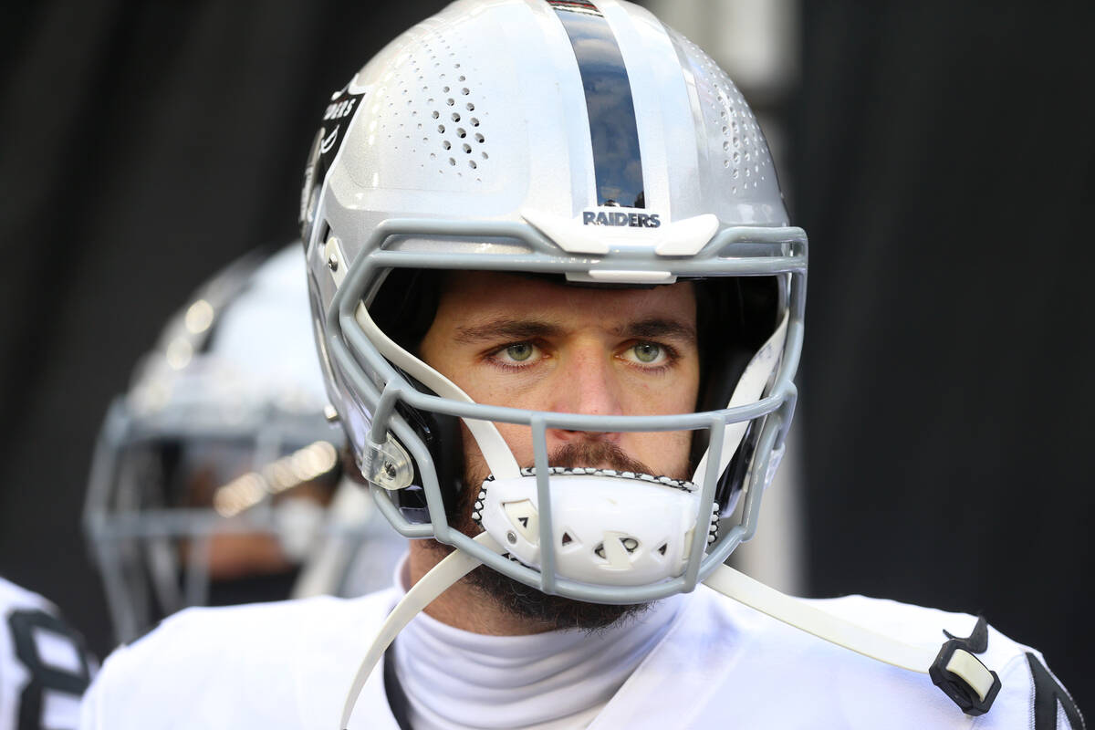 Raiders quarterback Derek Carr (4) waits to take the field for an NFL playoff game against the ...