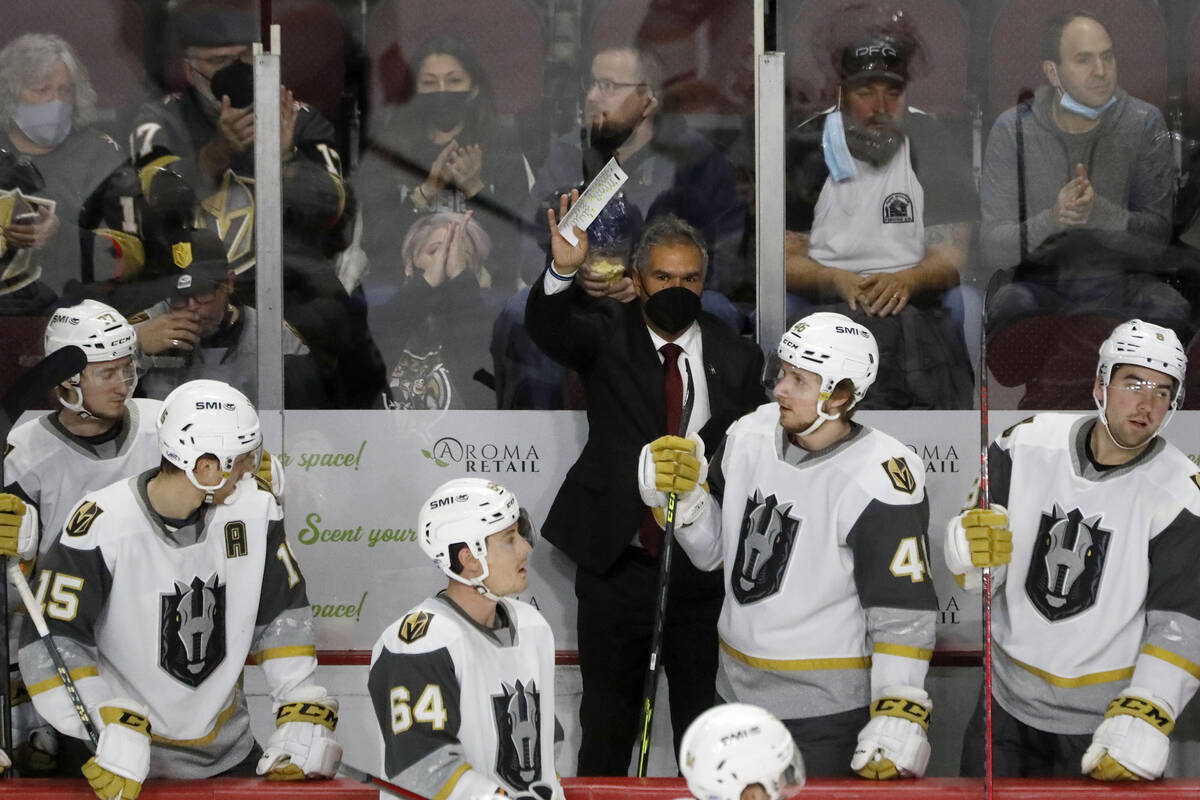 Henderson Silver Knights head coach Manny Viveiros waves to the audience during the first perio ...