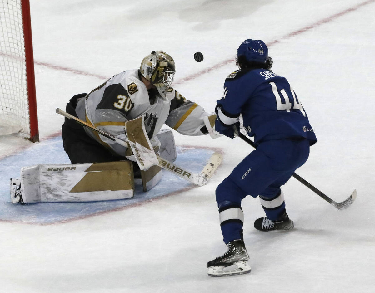 Henderson Silver Knights goalie Jiri Patera (30) makes a save against Colorado Eagles right wi ...