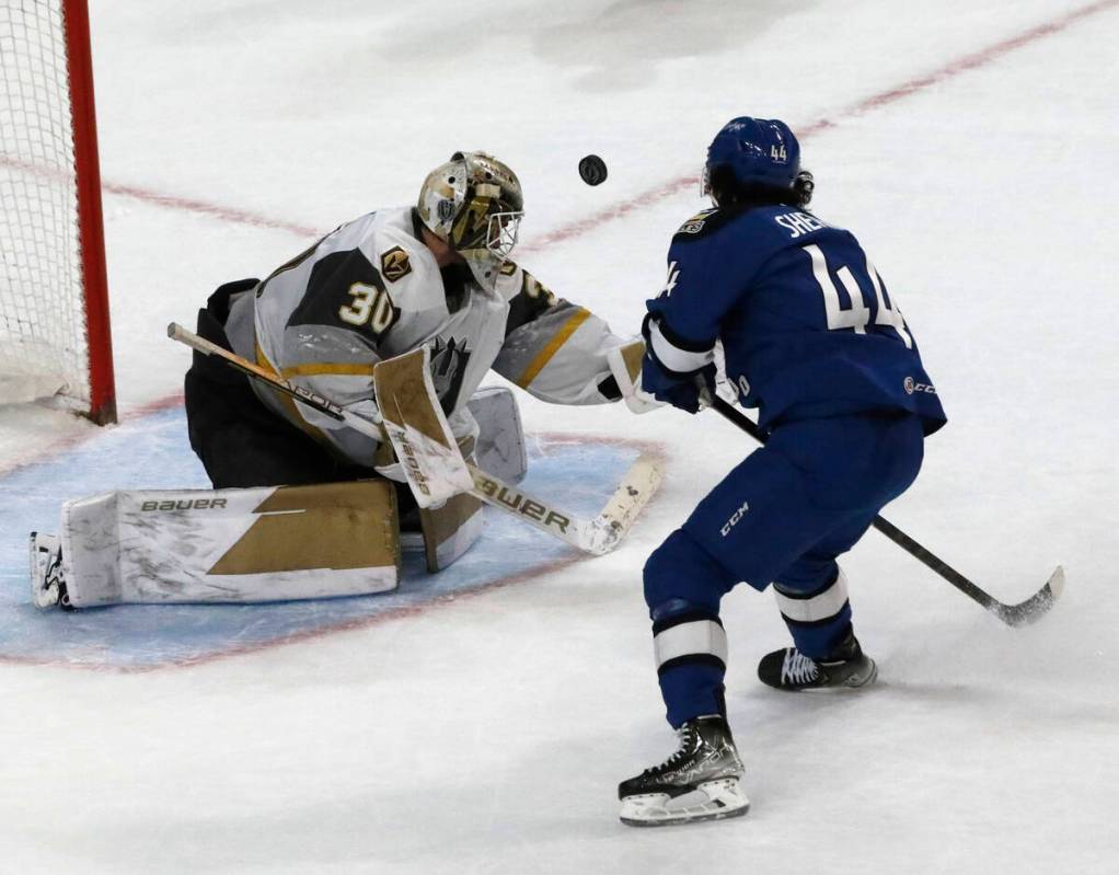 Henderson Silver Knights goalie Jiri Patera (30) makes a save against Colorado Eagles right wi ...