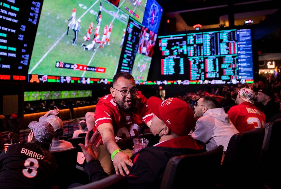 Emigdio Ojeda, from Menifee, Calif., cheers with friends during the Cincinnati Bengals, Kansas ...