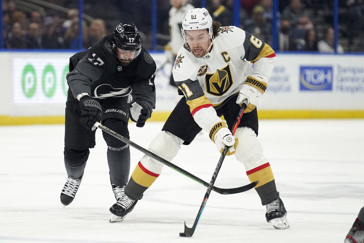 Vegas Golden Knights right wing Mark Stone (61) eludes Tampa Bay Lightning left wing Alex Killo ...