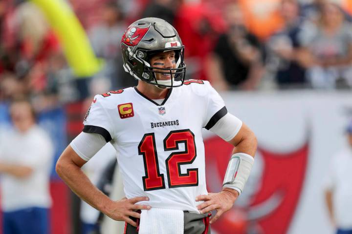 Tampa Bay Buccaneers quarterback Tom Brady (12) looks at the sideline for instructions during a ...