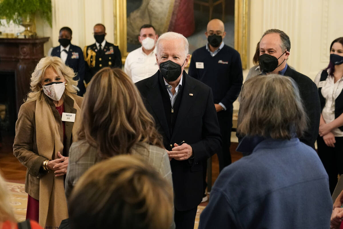 President Joe Biden speaks with spouses of members of the National Governors Association after ...