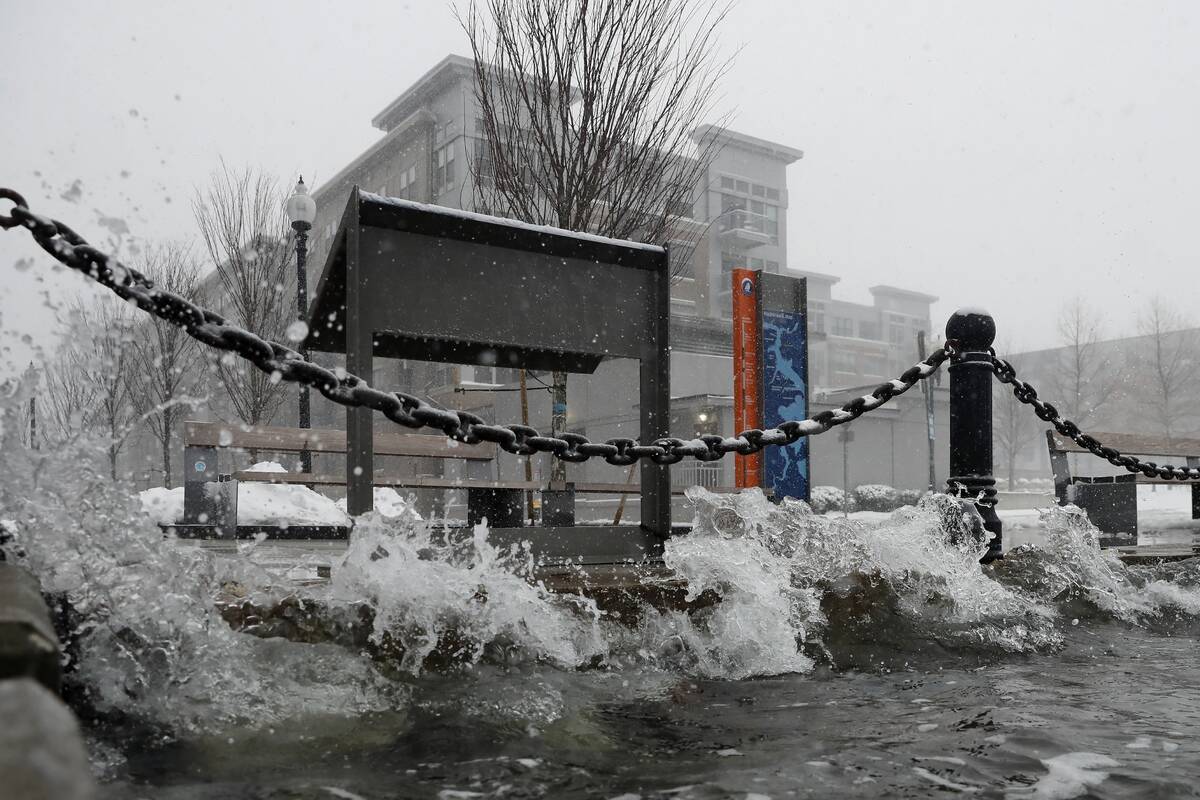 Water reaches flood level, Saturday, Jan. 29, 2022, in the East Boston neighborhood of Boston. ...