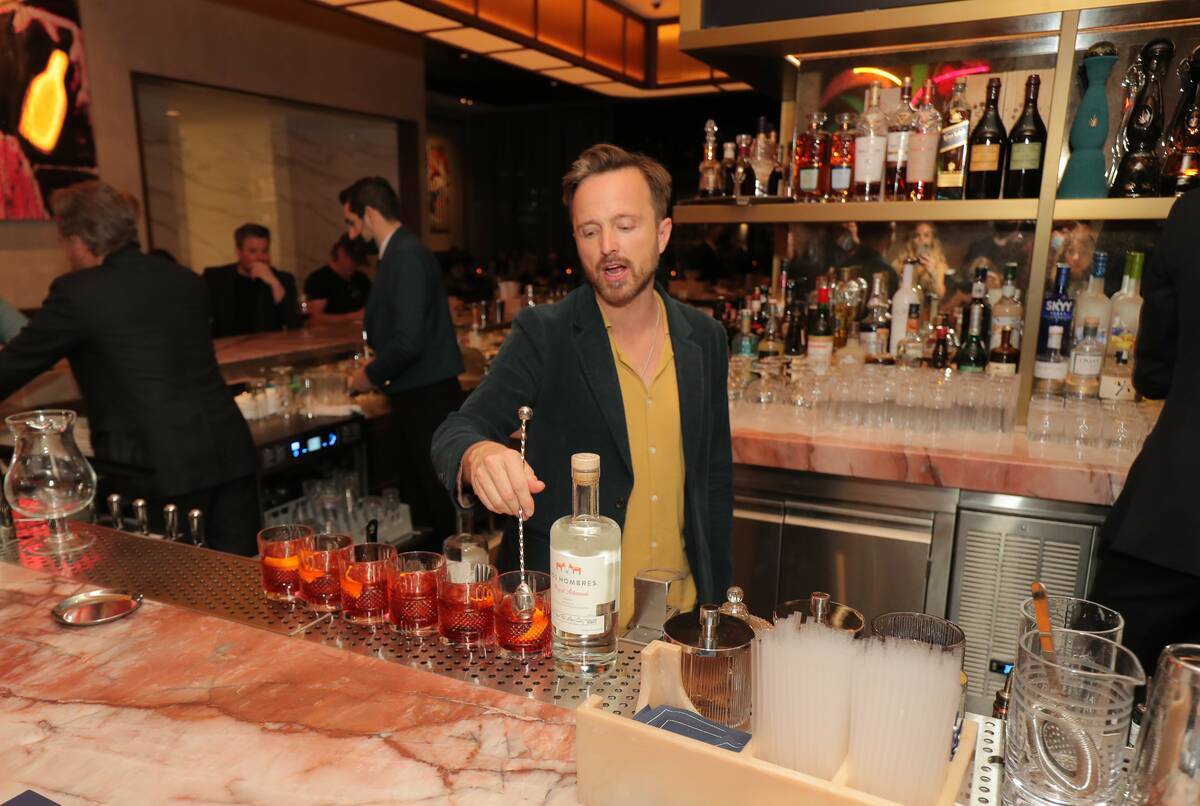 "Breaking Bad" co-star Aaron Paul mixes a drink with his Dos Hombres mezcal at Carversteak at R ...