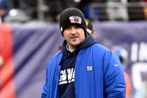 New York Giants head coach Joe Judge looks on during warmups before an NFL football game agains ...