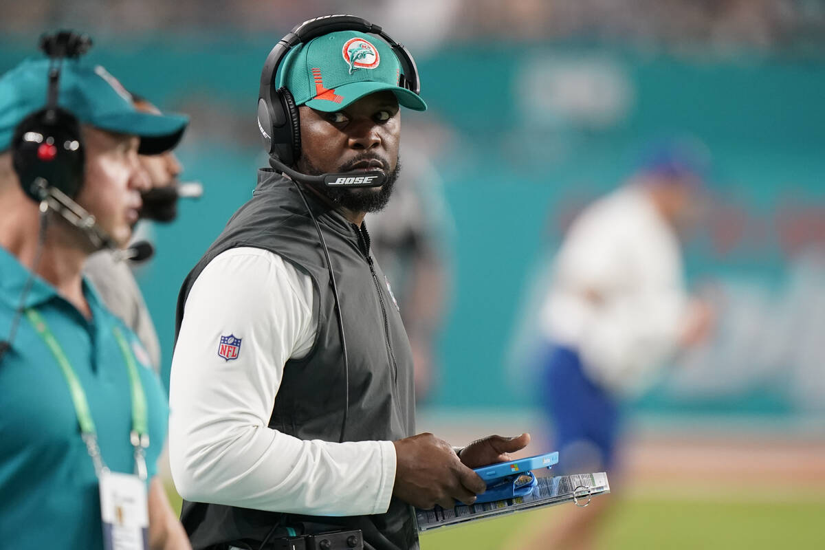 Miami Dolphins head coach Brian Flores guides his team from the sideline during the second half ...