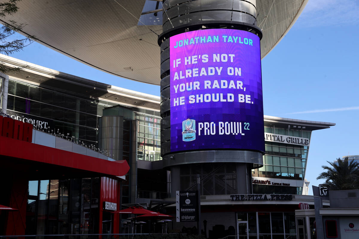 Pro Bowl pick, Indianapolis Colts running back Jonathan Taylor, is displayed on video screens a ...
