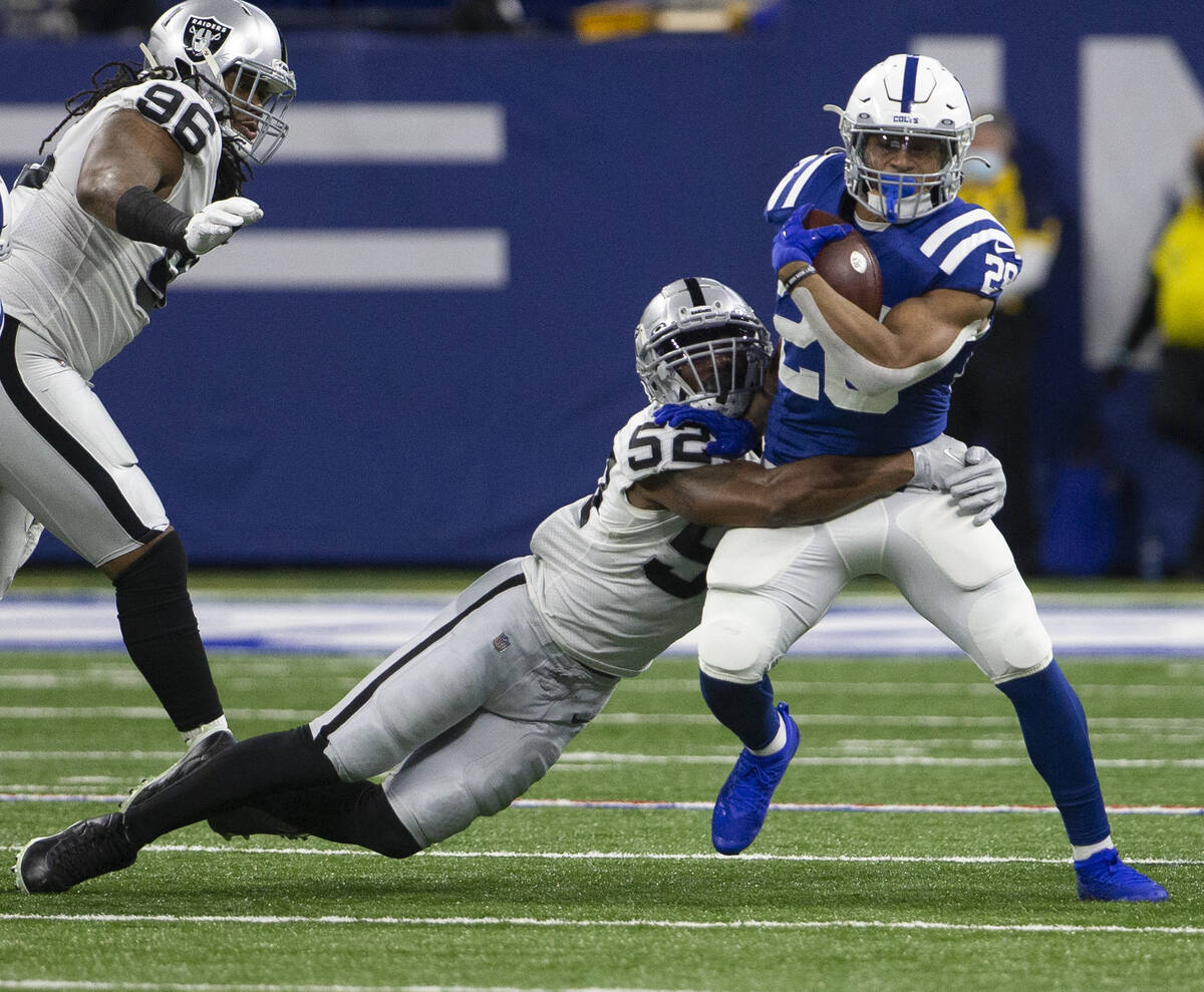 Raiders middle linebacker Denzel Perryman (52) tackles Indianapolis Colts running back Jonathan ...