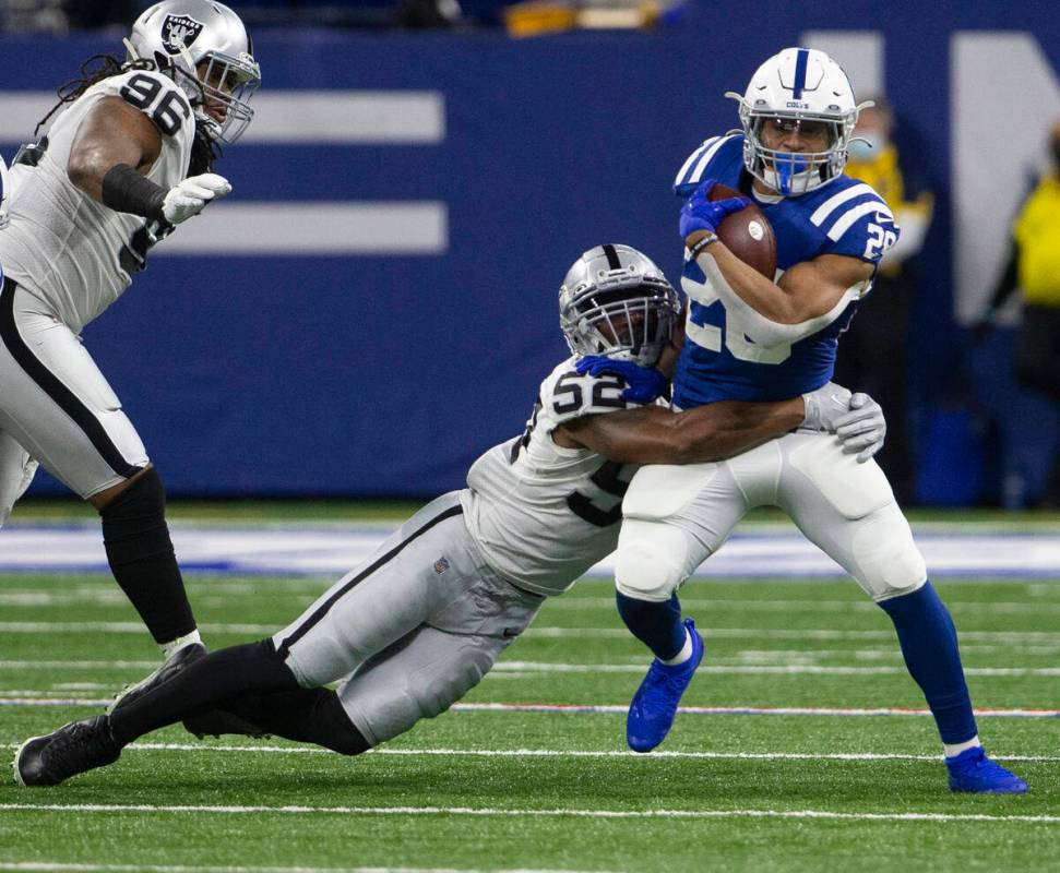 Raiders middle linebacker Denzel Perryman (52) tackles Indianapolis Colts running back Jonathan ...