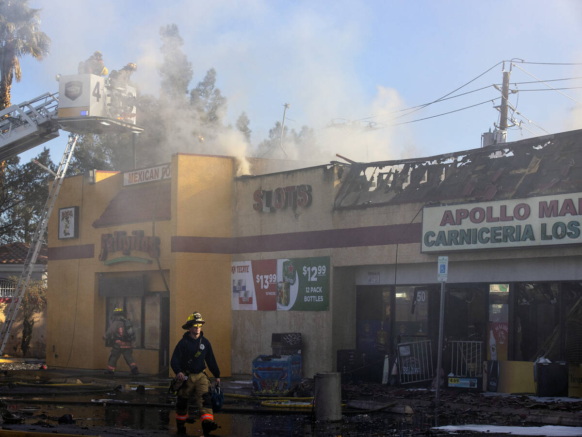 Las Vegas firefighters battle a two-alarm blaze at the Apollo Market on North Jones Boulevard o ...
