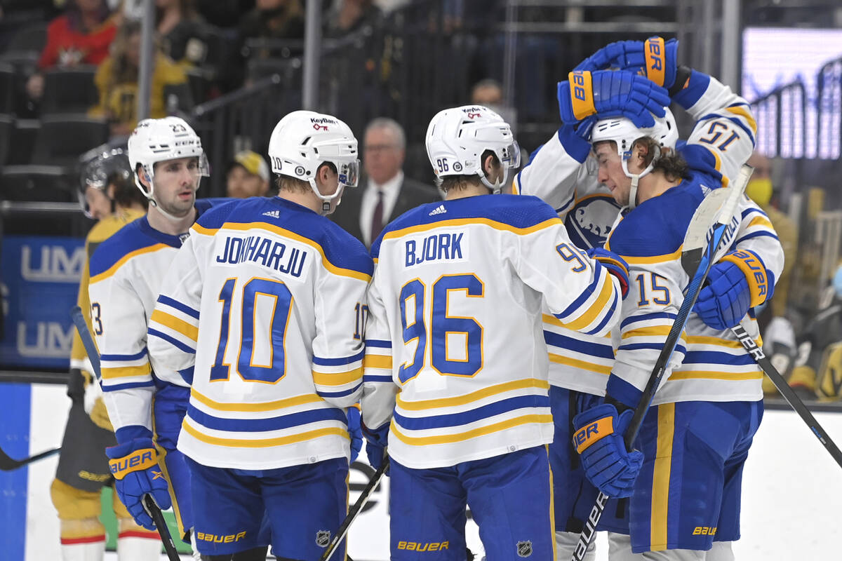 Buffalo Sabres center John Hayden (15) is congratulated by teammates after his goal against the ...