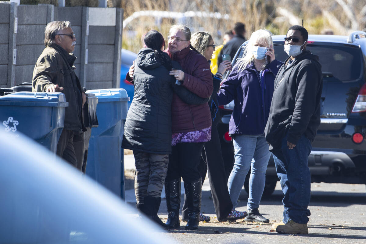 Family members comfort each other as Las Vegas police is investigating a possible murder suicid ...