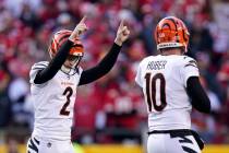 Cincinnati Bengals kicker Evan McPherson (2) celebrates with Kevin Huber (10) after kicking a 5 ...