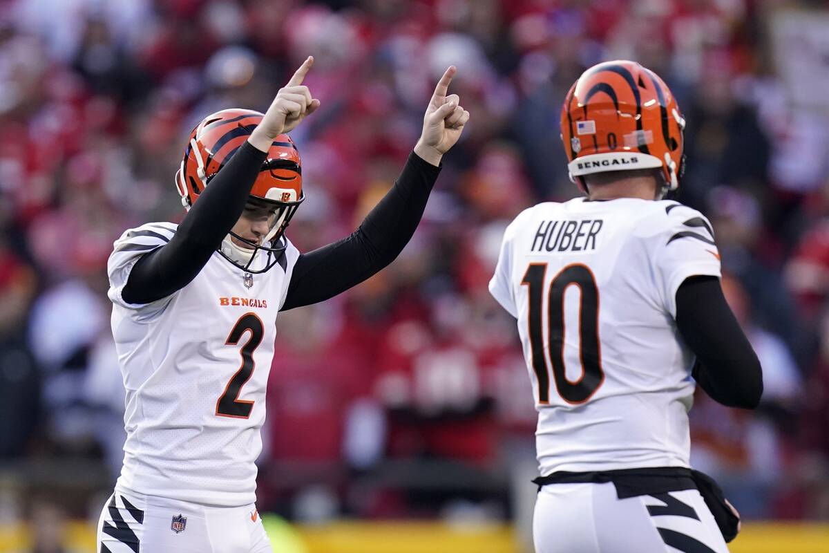 Cincinnati Bengals kicker Evan McPherson (2) celebrates with Kevin Huber (10) after kicking a 5 ...