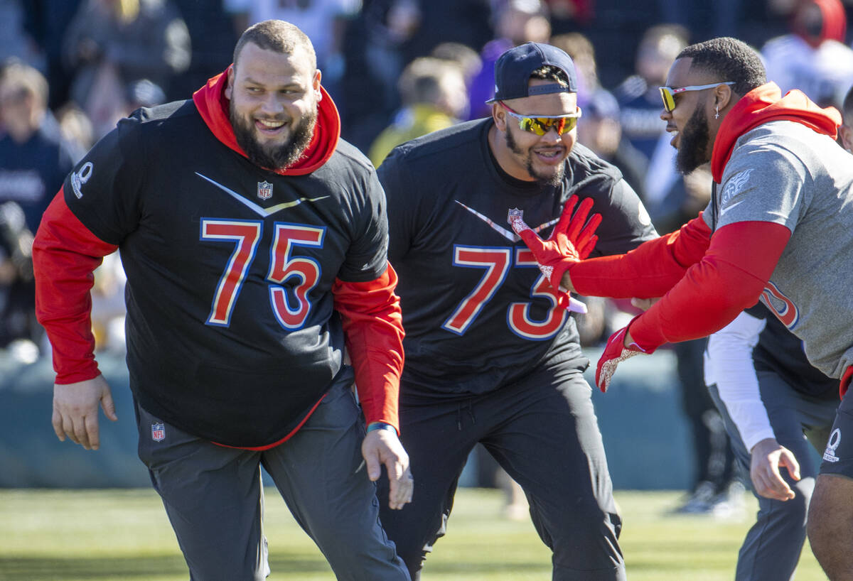 Cleveland Browns guard Joel Bitonio (75) and Buffalo Bills tackle Dion Dawkins (73) team up to ...