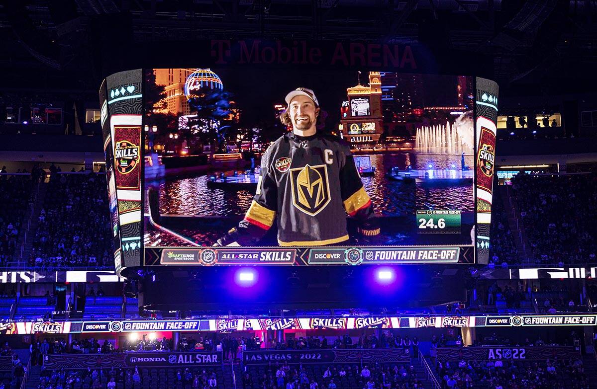 Fans watch a pre-recorded segment at the Bellagio Fountains featuring Golden Knights right wing ...