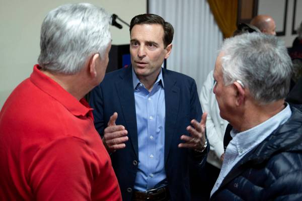 Republican U.S. Senate candidate Adam Laxalt talks to supporters after speaking at a campaign e ...