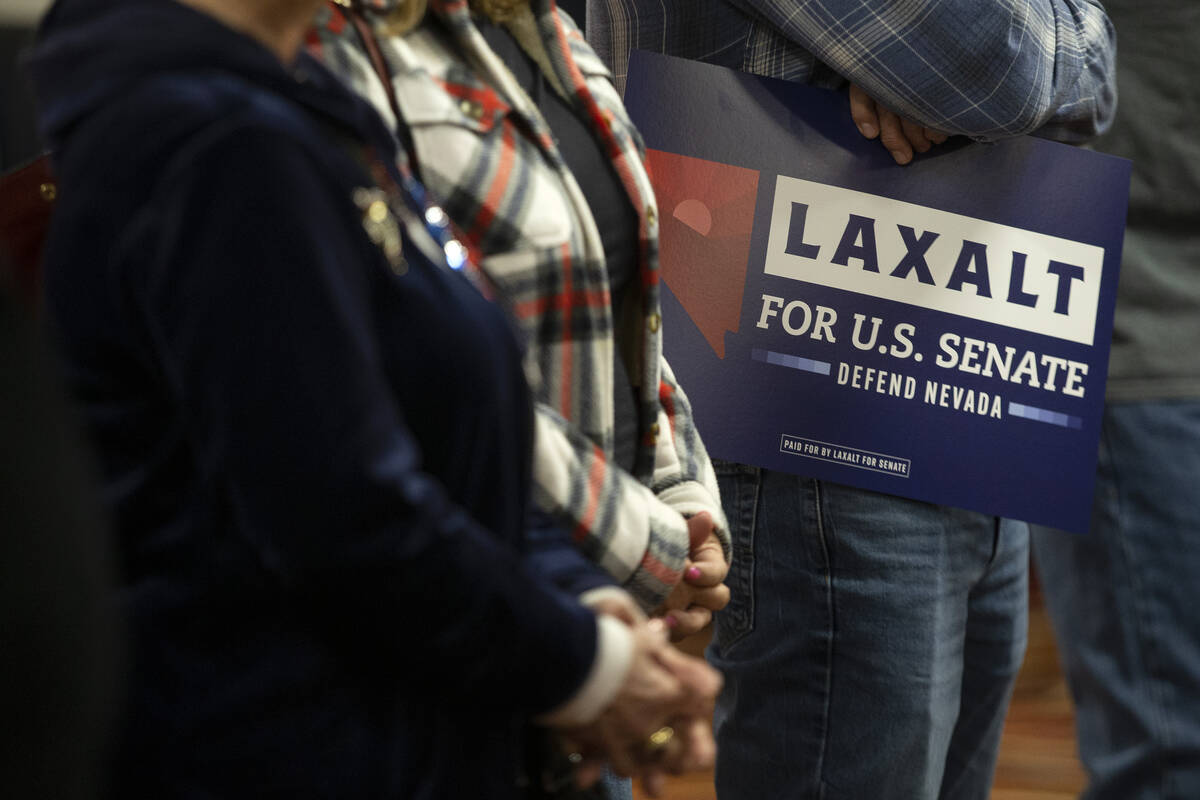 Attendees listen to speakers during a campaign event for Republican U.S. Senate candidate Adam ...