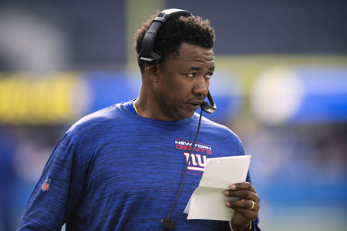 FILE - New York Giants defensive coordinator Patrick Graham stands on the field before the team ...