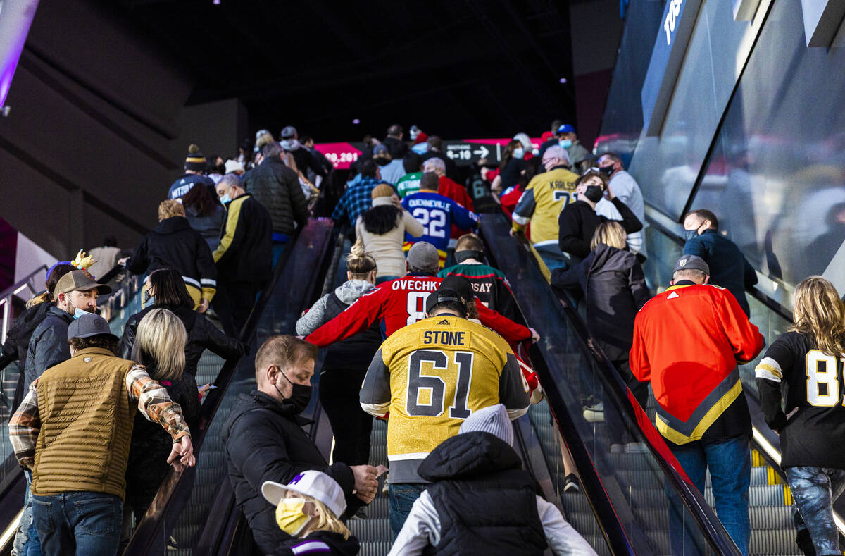 Fans make their way to their seats before the start of the NHL All-Star skills competition on F ...