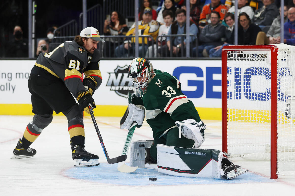 Vegas Golden Knights forward Mark Stone (61) shoots the puck against Minnesota Wild goalkeeper ...