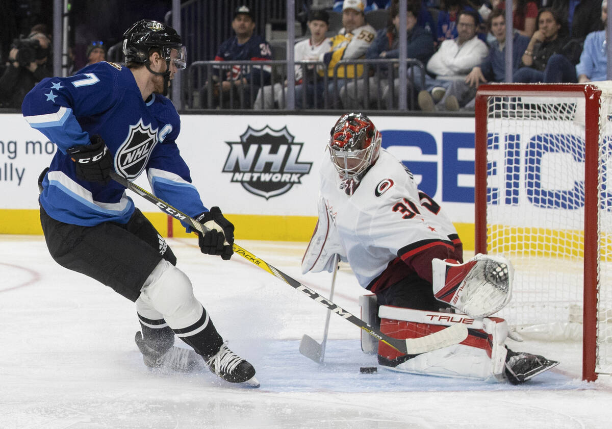 Edmonton Oilers forward Connor McDavid (97) shoots on Carolina Hurricanes goaltender Frederik A ...