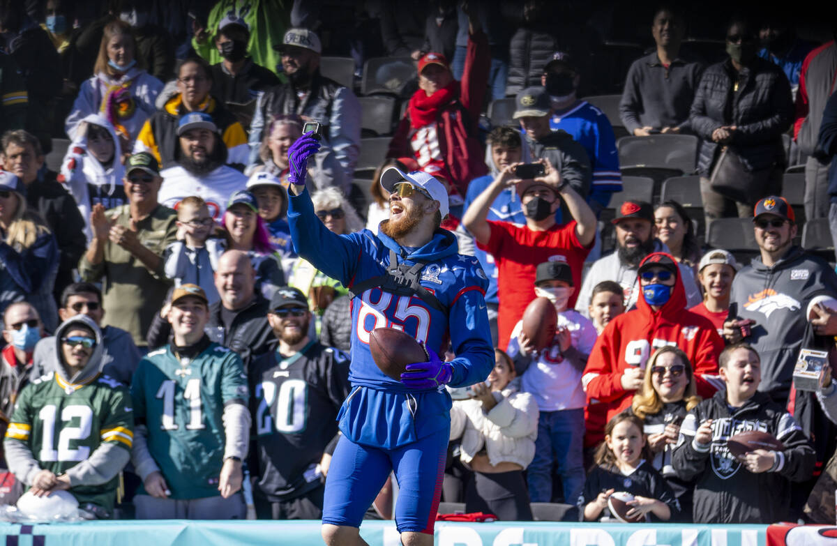 San Francisco 49ers tight end George Kittle (85) takes a selfie with the fans during the NFC Pr ...