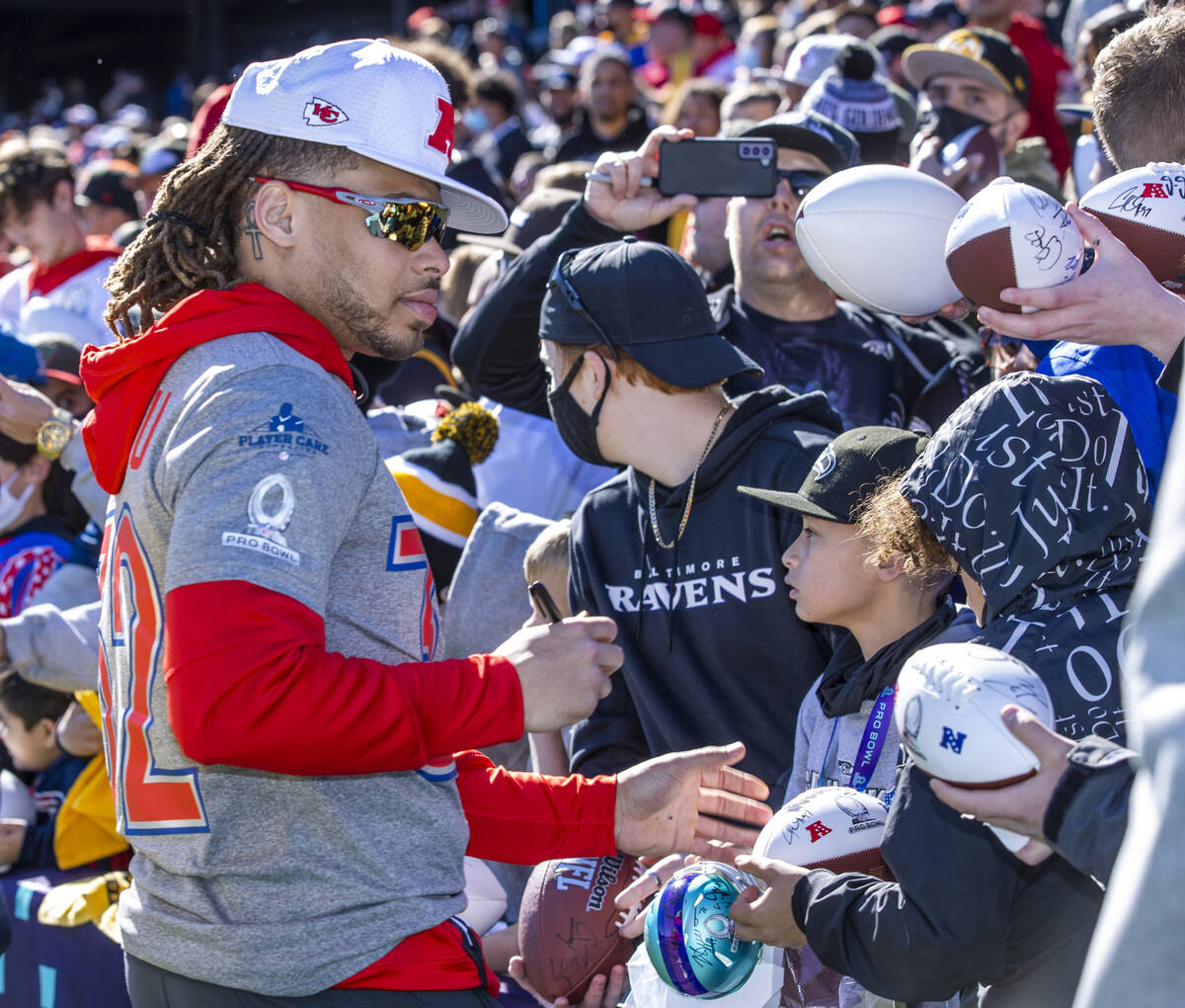 Kansas City Chiefs Tyrann Mathieu (32) signs autographs for fans during the AFC Pro Bowl player ...