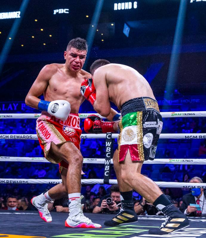 Jesús Ramos, left, connects to the body of Vladimir Hernandez during the sixth round their ...