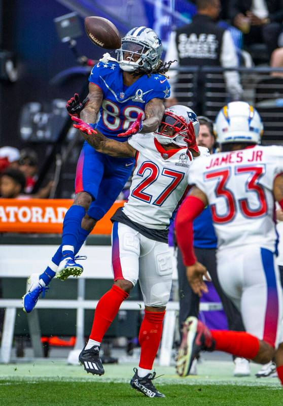 NFC wide receiver CeeDee Lamb of the Dallas Cowboys (88) elevates for a long pass as AFC corner ...