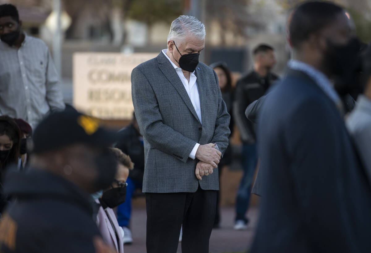 Gov. Steve Sisolak bows his head during an event honoring the victims of the North Las Vegas ca ...