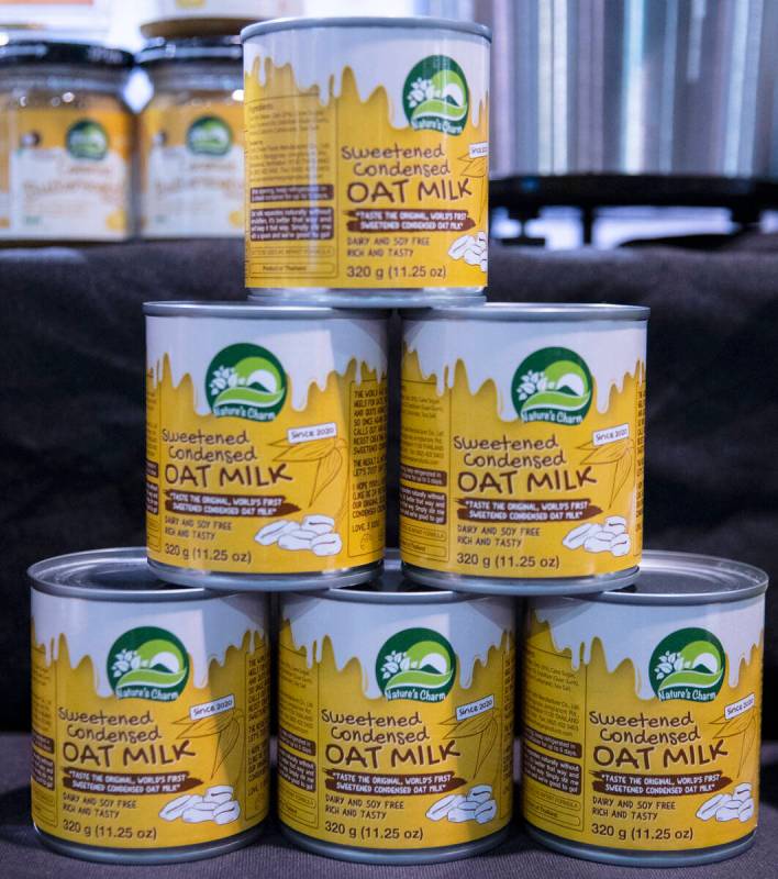 Cans of sweetened condensed oat milk by Nature's Charm are displayed during the Fancy Food Show ...