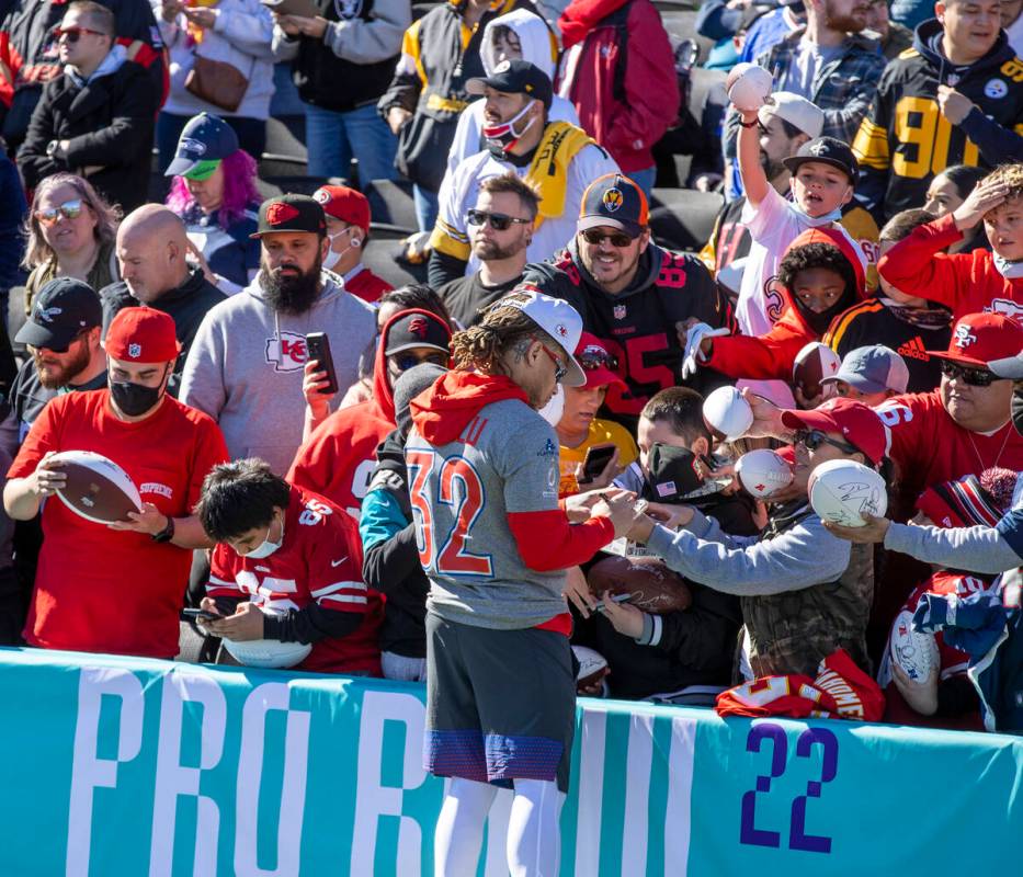 Kansas City Chiefs Tyrann Mathieu (32) signs autographs for fans during the AFC Pro Bowl player ...