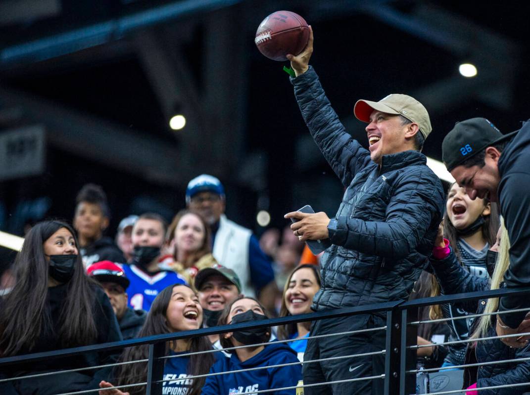 A fan celebrates receiving game ball during the first half of the Pro Bowl at Allegiant Stadium ...