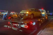 A vehicle that was involved a six-vehicle crash is towed away from the scene of a fatal acciden ...