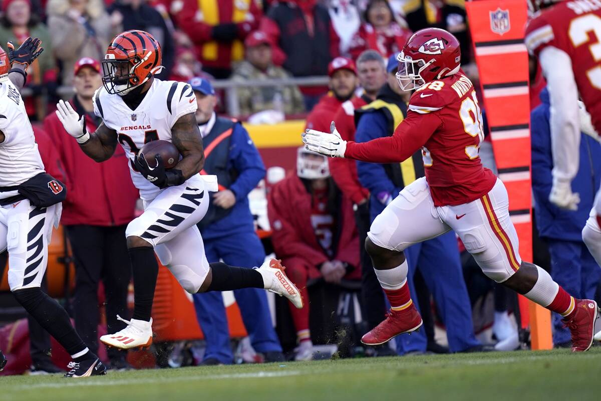 Cincinnati Bengals running back Samaje Perine (34) gets past Kansas City Chiefs defensive end T ...