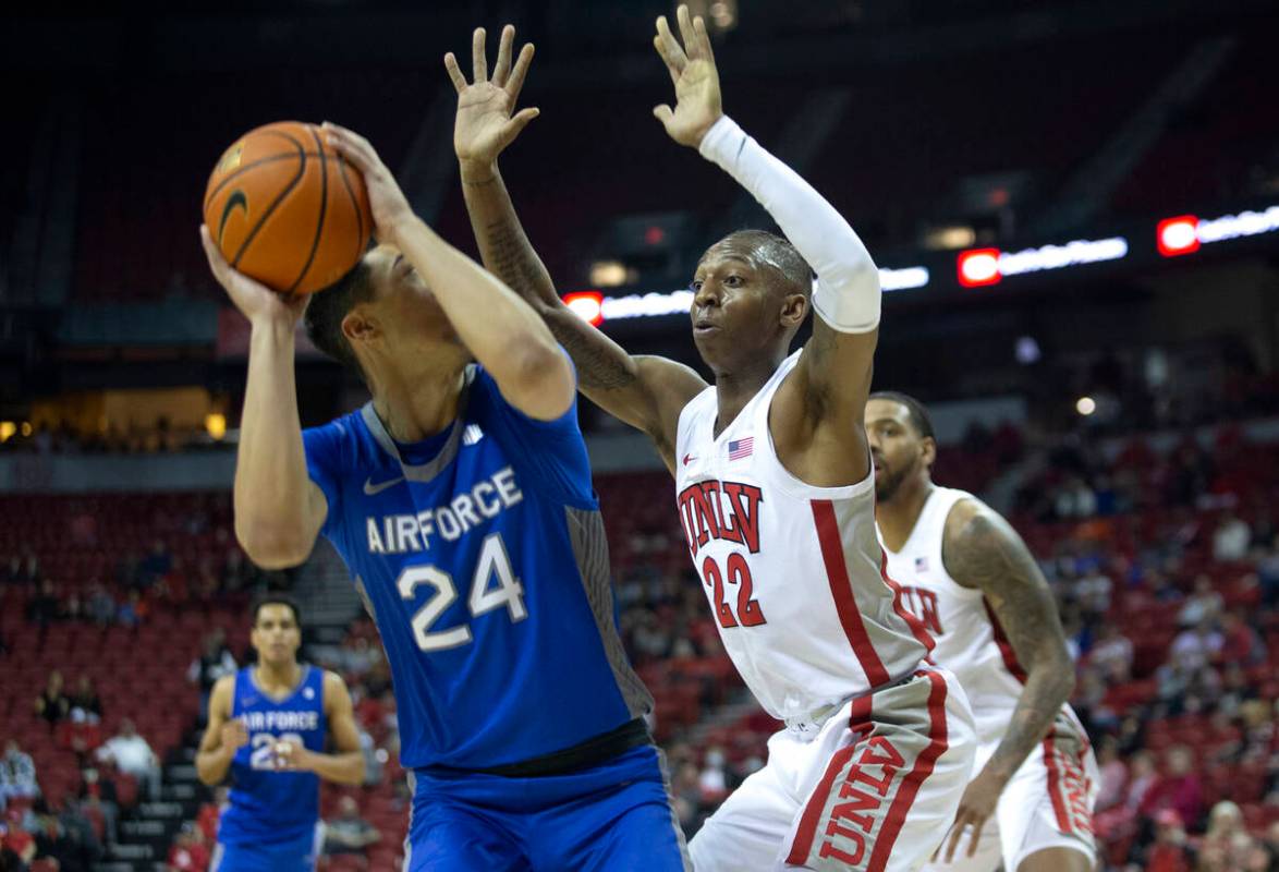 UNLV Rebels guard Josh Baker (22) defends against Air Force Falcons guard Jeffrey Mills (24) du ...