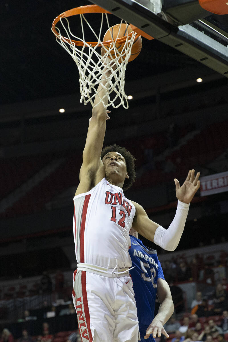 UNLV Rebels center David Muoka (12) shoots against Air Force Falcons center Ryan Corner (50) du ...