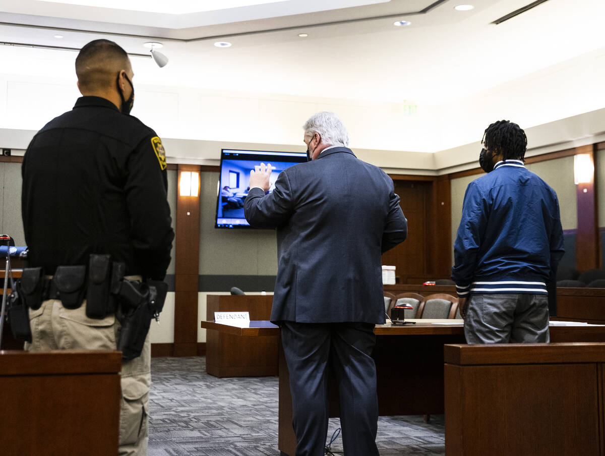 Luther Childers, right, arrested in his 2-month-old’s death, listens as his attorney Sco ...