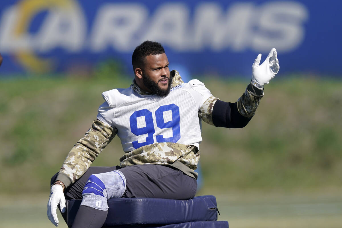 Los Angeles Rams defensive end Aaron Donald sits prior to practice for an NFL Super Bowl footba ...