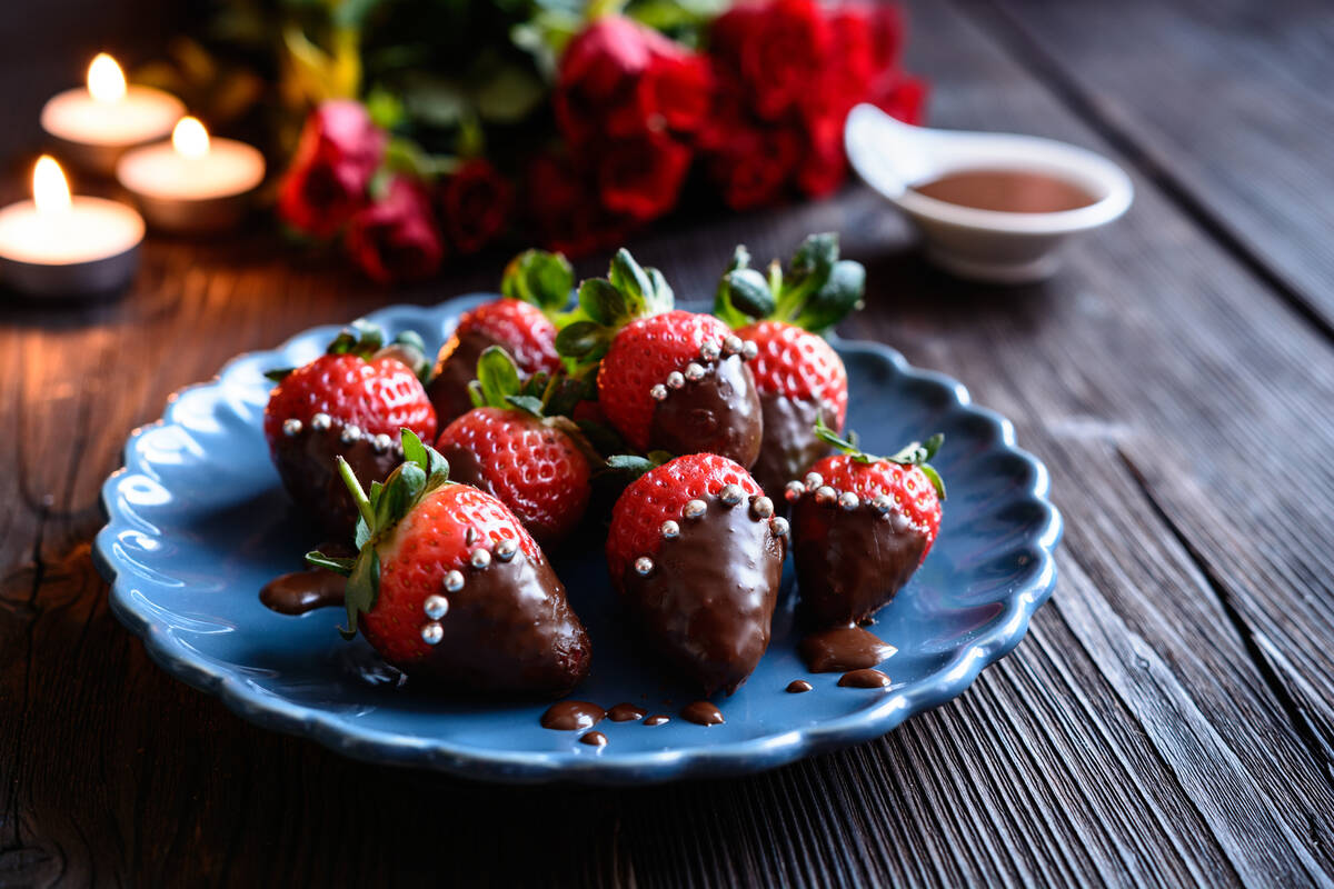 Delicious chocolate covered strawberries, decorated with silver sprinkles for Valentine's Day. ...