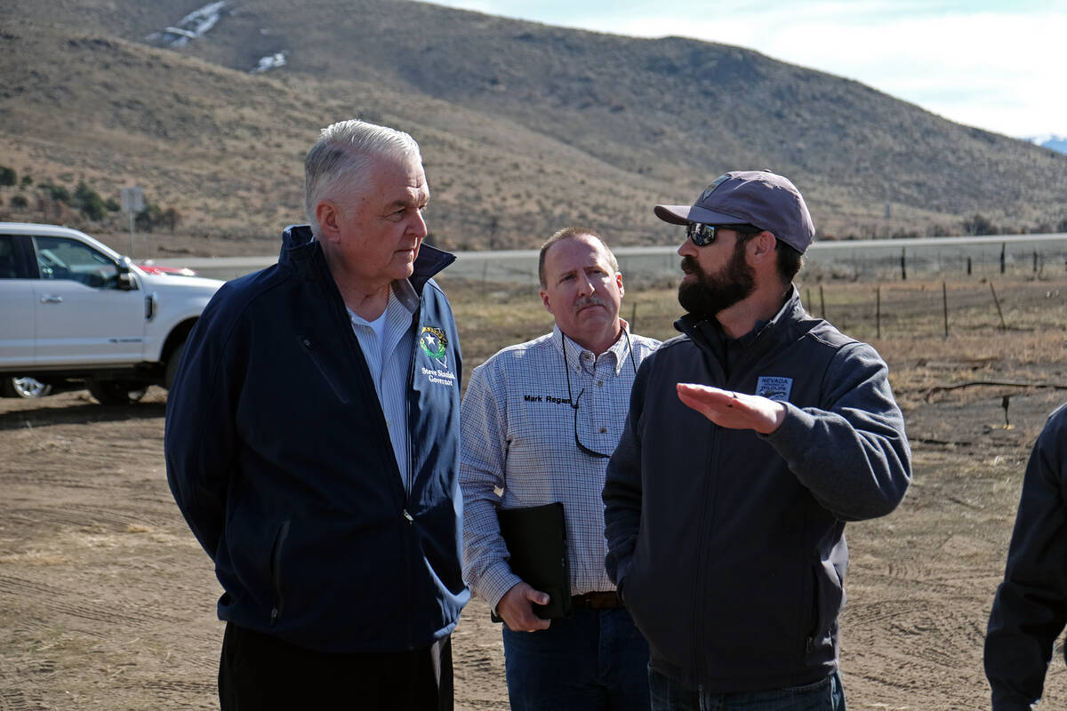 Ecologist Mark Freese of the Nevada Department of Wildlife briefs Gov. Steve Sisolak on reseedi ...