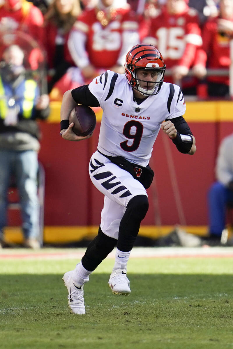 Cincinnati Bengals quarterback Joe Burrow runs the ball during the AFC championship NFL footbal ...