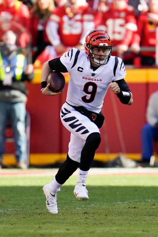 Cincinnati Bengals quarterback Joe Burrow runs the ball during the AFC championship NFL footbal ...